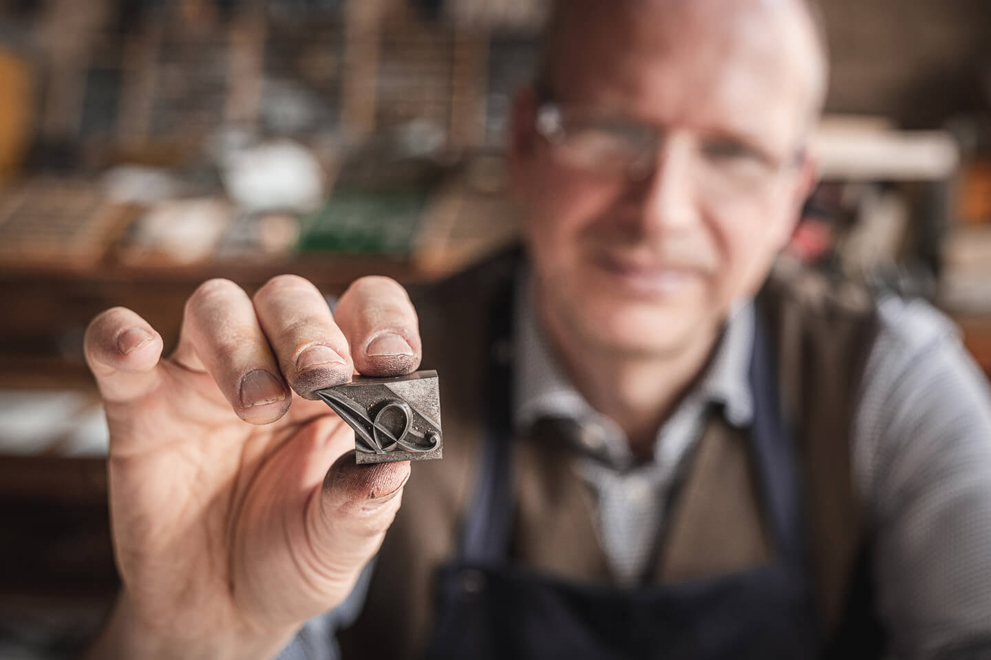 Schriftsetzer mit geschwungenem A